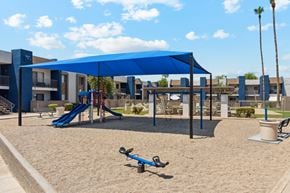 Mesa apartment for rent - A playground with a blue canopy and a slide.