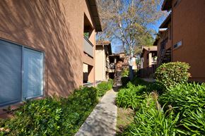 Vista apartment for rent - a view of the pathway between the buildings at Elan Vista Alta.