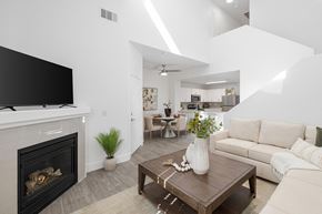 Las Vegas apartment for rent - A modern living room with a fireplace and a television.