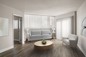 La Jolla apartment for rent - A modern living room with a white sofa, a wooden coffee table, and a white chair.