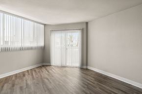 La Jolla apartment for rent - A room with a window covered by white blinds.