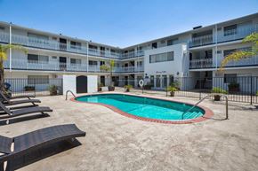 Sherman Oaks apartment for rent - Swimming pool with lounge chairs surronding.