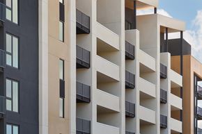 San Diego apartment for rent - A tall building with balconies and windows.