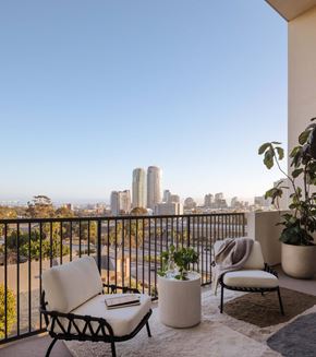 San Diego apartment for rent - Balcony view of chairs and railing with view of Downtown San Diego during the daytime.