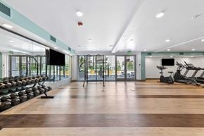 Los Angeles apartment for rent - The Elinor's gym with a variety of equipment including treadmills, weights, and exercise machines.