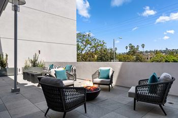 Cozy outdoor fireplace lounge area perfect for evening gatherings