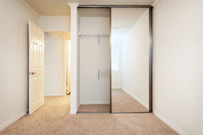 Oceanside apartment for rent - a mirrored closet door in a bedroom