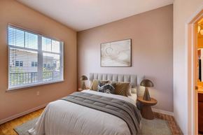 Boulder apartment for rent - A bedroom with a large bed and a painting on the wall.