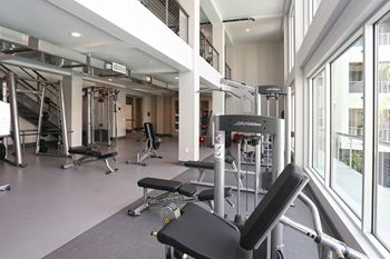 Two-story fitness room featuring life fitness equipment