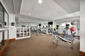 Anaheim apartment for rent - A gym with a variety of equipment including weights and cardio machines.