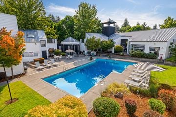 Beaverton apartment for rent - A large backyard with a pool and a gazebo.