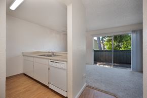 Modesto apartment for rent - Kitchen with breakfast bar and living room.