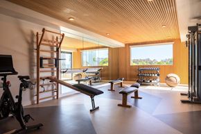 San Diego apartment for rent - A gym with a wooden floor and a wooden ceiling.