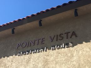 Vista apartment for rent - a sign on the side of a building that reads pointe vista apartment homes