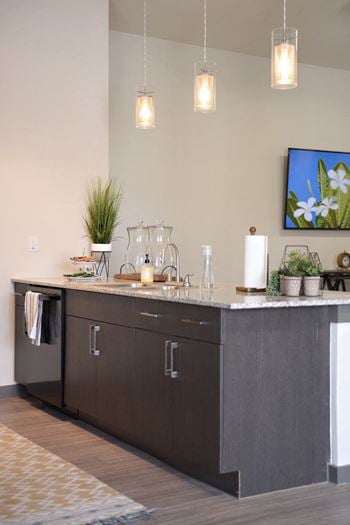 A kitchen with a sink and a counter top