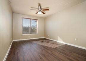 Denton apartment for rent - Empty bedroom with wood style flooring at City Place Apartments, Denton, TX 76201