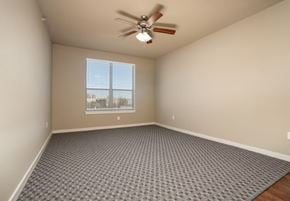 Denton apartment for rent - Spacious bedroom with ceiling fan and carpet at City Place Apartments, Denton, TX