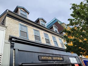 Kingston apartment for rent - A building with a sign that says "Antique Emporium" on it.