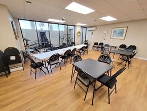 Kingston apartment for rent - a dining room with tables and chairs and a wood floor