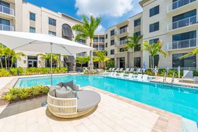 Tamarac apartment for rent - a swimming pool in front of an apartment building