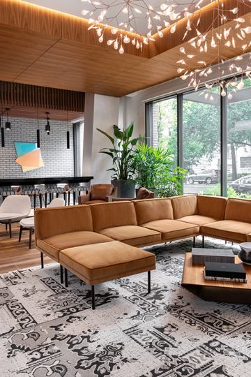 Washington apartment for rent - A living room with a large sectional sofa and a coffee table.