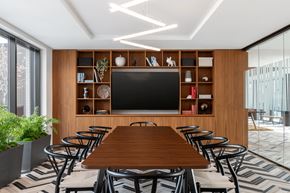 Washington apartment for rent - A modern dining room with a wooden table and chairs.