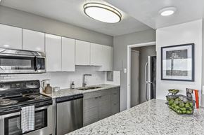 Indianapolis apartment for rent - Renovated kitchen with stainless steel appliances and bright lights at CityView on Meridian, Indiana, 46208