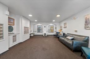 Garden City apartment for rent - a living room with leather furniture and white walls