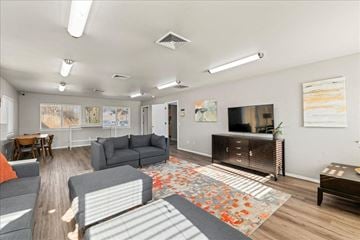 Caldwell apartment for rent - A living room with grey couches and a wooden floor.