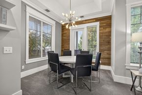 Ammon apartment for rent - A dining room with a table and chairs.
