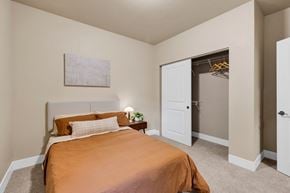 Missoula apartment for rent - A bedroom with a bed and a painting on the wall at Brooklyn West Apartments, Missoula, MT