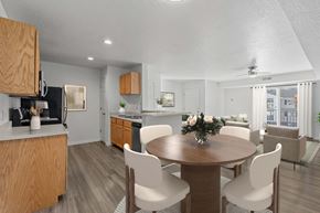 Ammon apartment for rent - A modern kitchen with a dining table set for four. at Eagles Landing, Ammon, ID
