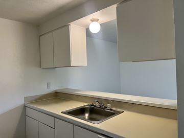 Boise apartment for rent - A kitchen with a sink and cabinets.