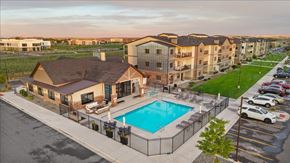 Billings apartment for rent - A large apartment complex with a pool in the foreground.