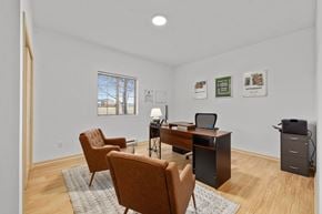 Billings townhouse for rent - A room with a desk, chairs, and pictures on the wall at King West One Apartments, Billings, MT