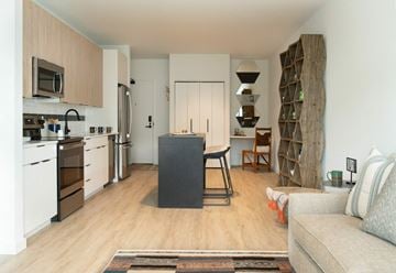 Bozeman apartment for rent - a living room with a kitchen and a table