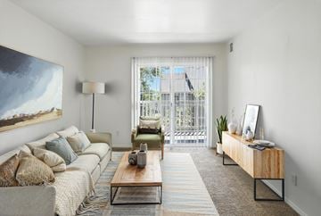 Clearfield apartment for rent - A living room with a couch, a coffee table, and a painting on the wall.