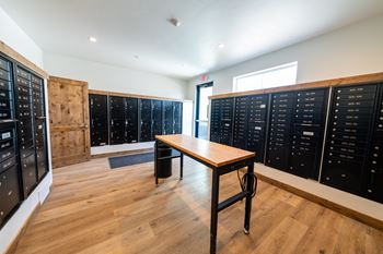 A room with a table and a list of names on the wall.