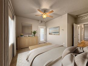 Nampa townhouse for rent - a bedroom with a large bed and a ceiling fan at Southside Townhomes, Nampa, ID