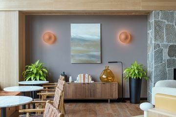Boise apartment for rent - a living room with tables and chairs and a painting on the wall