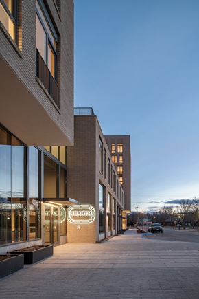 Boise apartment for rent - a sidewalk in front of a building with a sign