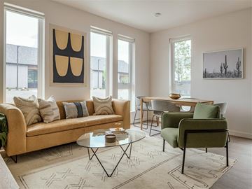 Eagle apartment for rent - a living room with a couch and chairs and a table