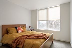 Boise apartment for rent - a bedroom with a bed and a large window at The Lucy Boise Apartments, Boise, 83702