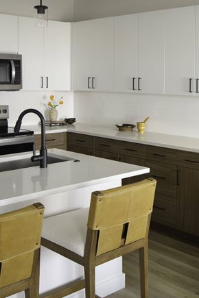 Bozeman apartment for rent - A kitchen with a white counter top and two chairs.