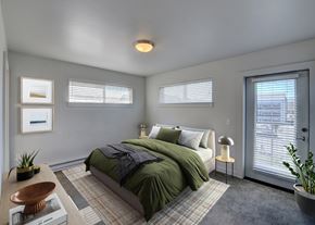 Bozeman apartment for rent - A bedroom with a bed, nightstand, and window at Four Points, Montana