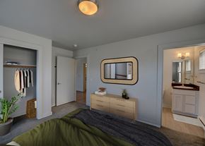 Bozeman apartment for rent - A bedroom with a bed, dresser, mirror, and closet at Four Points, Montana