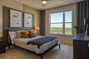 Aurora apartment for rent - a bedroom with a large bed and a window