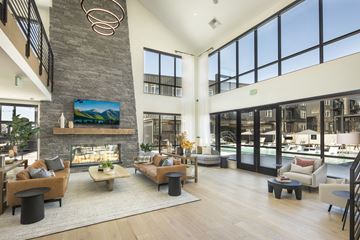 Longmont apartment for rent - a large living room with couches and chairs and a fireplace