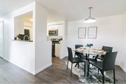 Boise apartment for rent - Modern dining area with glass table and pendant lighting at Edgewater Apartments, Boise, ID 83703