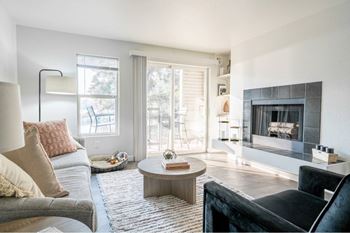Contemporary living room with builtin fireplace and seating